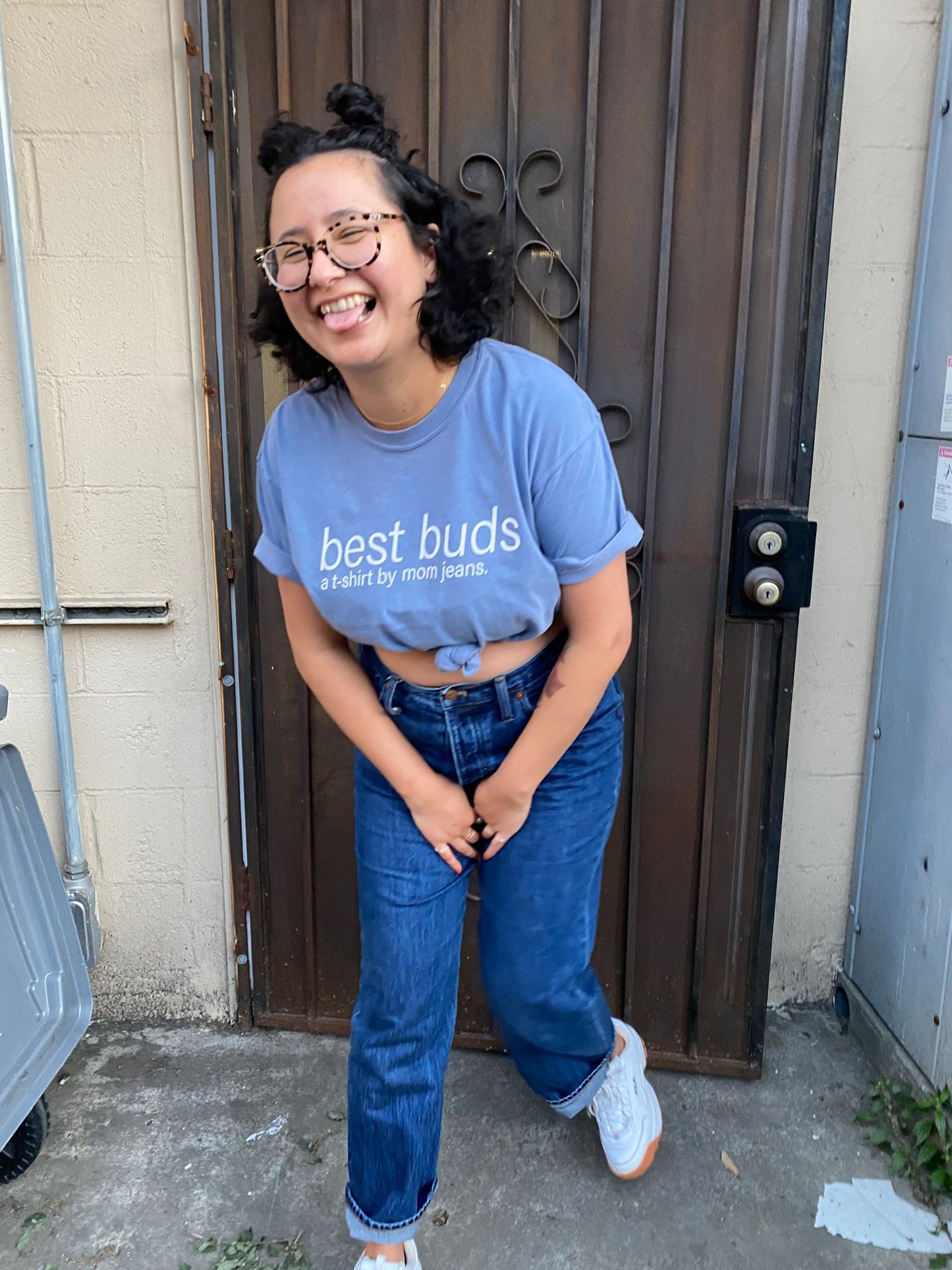 A T-SHIRT BY MOM JEANS.